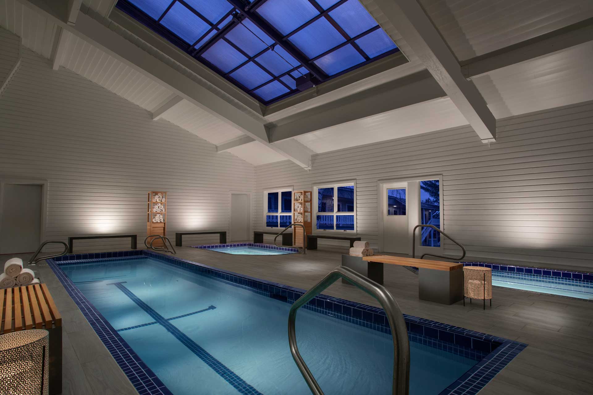 PoolBase4 luxurious indoor pool and hot tub facilities with a skylight